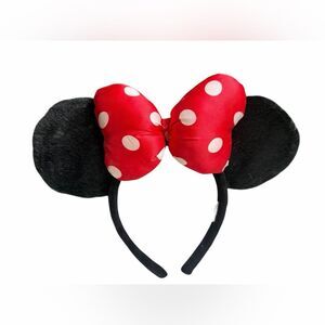 Disney Parks Minnie Mouse ear headband with a red and white polka dot satin bow